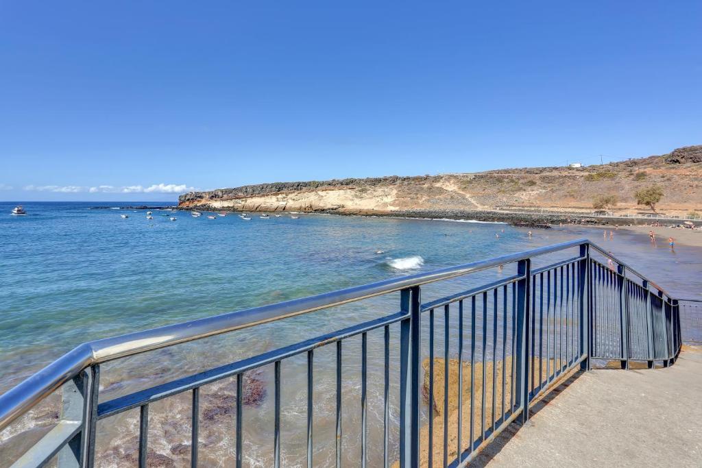 La Casa del Capitán - railing-view-of-beach-and-bay